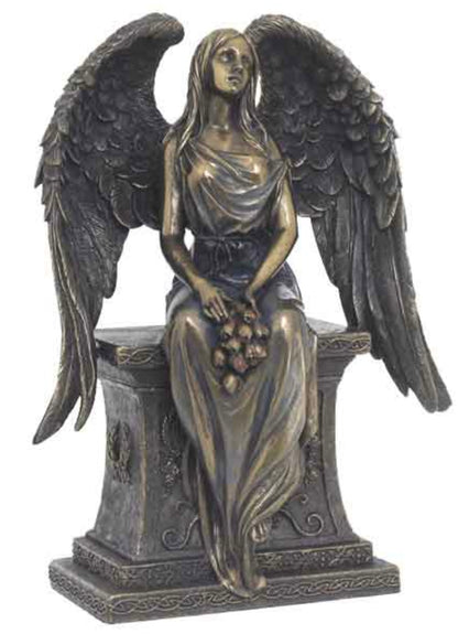 Bronze Angel with Roses Sitting on a Tombstone